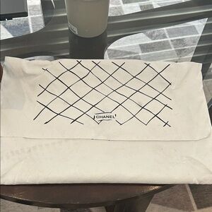 CHANEL White Dust Bag with Black Quilted Grid Print